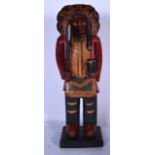 A LARGE CARVED WOODEN FIGURE OF A NATIVE AMERICAN, modelled standing in typical dress holding an