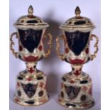 A HUGE PAIR OF ROYAL VIENNA PORCELAIN TWIN HANDLED VASES, decorated with panels of foliage. 60 cm