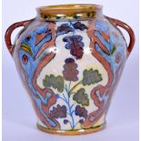 AN EARLY 20TH CENTURY ABSTRACT LUSTRE TWIN HANDLED POTTERY VASE, decorated with animals and foliage.