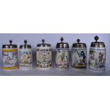 A GROUP OF SIX HOLSTEN ANNUAL POTTERY FAIENCE TANKARDS, decorated with figures, boats and animals,