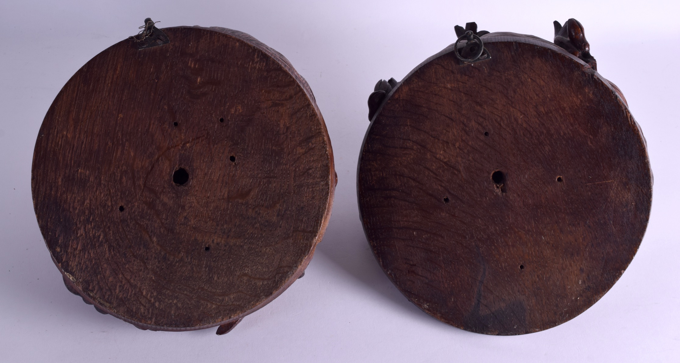 A LOVELY PAIR OF ENGLISH ARTS AND CRAFTS CARVED OAK WALL PLAQUES in the form of female mask heads. - Image 2 of 2