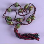 AN EARLY 20TH CENTURY CONTINENTAL ENAMELLED GLASS NECKLACE. 88 cm long.