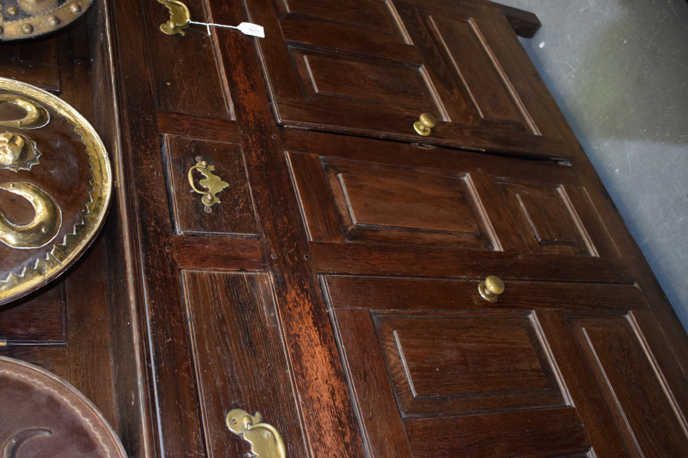 AN 18TH CENTURY OAK COURT CUPBOARD, with fitted drawers, panelled doors and swan neck brass handles. - Image 4 of 4