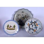 THREE EARLY 20TH CENTURY FAIENCE POTTERY PLATES, two depicting birds and the other a house.