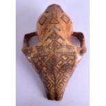 AN 18TH CENTURY TRIBAL CARVED ENGRAVED ANIMAL SKULL decorated with various motifs. 27 cm x 18 cm.
