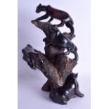 A LARGE AFRICAN CARVED HARDWOOD FIGURAL GROUP depicting five roaming panthers upon a naturalistic