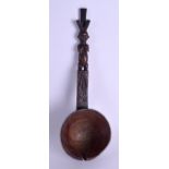 AN AFRICAN CARVED TRIBAL FERTILITY SPOON. 33 cm long.