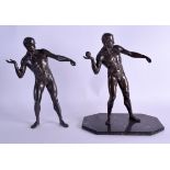 A PAIR OF ART DECO SPELTER FIGURES OF SHOT PUTTERS. 28 cm high.