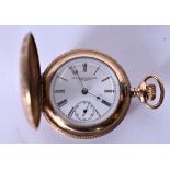 A NEW YORK STANDARD WATCH CO. YELLOW METAL POCKET WATCH, the case engraved with birds amongst