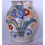 A COLOURFUL POOLE POTTERY JUG, painted with flowers, bearing impressed mark to base. 21 cm wide.