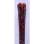AN EARLY VICTORIAN PIQUE WORK AMBER HANDLED SWAGGER STICK silver and gold inlaid with floral sprays.