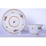 AN 18TH CENTURY WORCESTER PORCELAIN SHANKERED TEA CUP AND SAUCER, decorated with gilt banding and