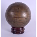 A MIDDLE EASTERN BRONZE ASTROLABE GLOBE decorated with motifs. 11.5 cm wide.