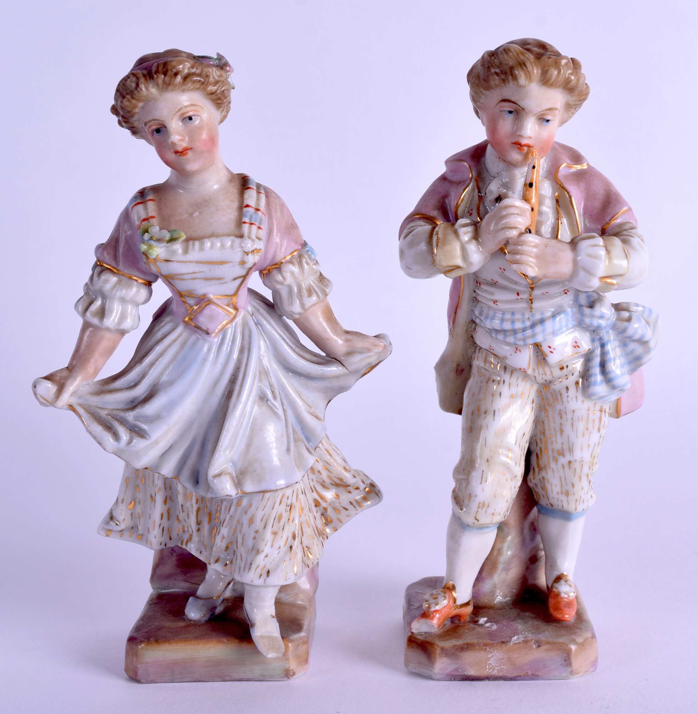 A SMALL PAIR OF 19TH CENTURY GERMAN PORCELAIN FIGURES modelled as a male and female. 12.5 cm high.