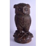 AN EARLY 20TH CENTURY BAVARIAN BLACK FOREST OWL TOBACCO JAR modelled standing upon a naturalistic