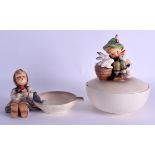 A GERMAN GOEBEL HUMMEL BOWL AND COVER formed with a boy holding rabbits, together with a figural