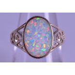 A SILVER AND OPAL RING. Size N/O.