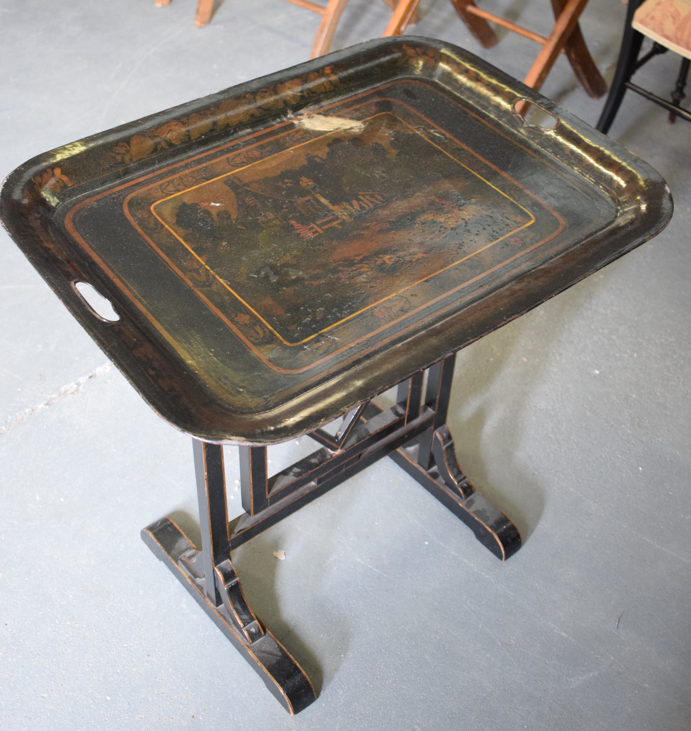 AN EARLY 20TH CENTURY TOLEWARE TRAY TOP TABLE, decorated with foxhunting scenes. 60 cm x 62 cm.