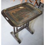 AN EARLY 20TH CENTURY TOLEWARE TRAY TOP TABLE, decorated with foxhunting scenes. 60 cm x 62 cm.