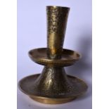 AN EARLY 20TH CENTURY ISLAMIC BRONZE CANDLETICK HOLDER, decorated with figures in panels and