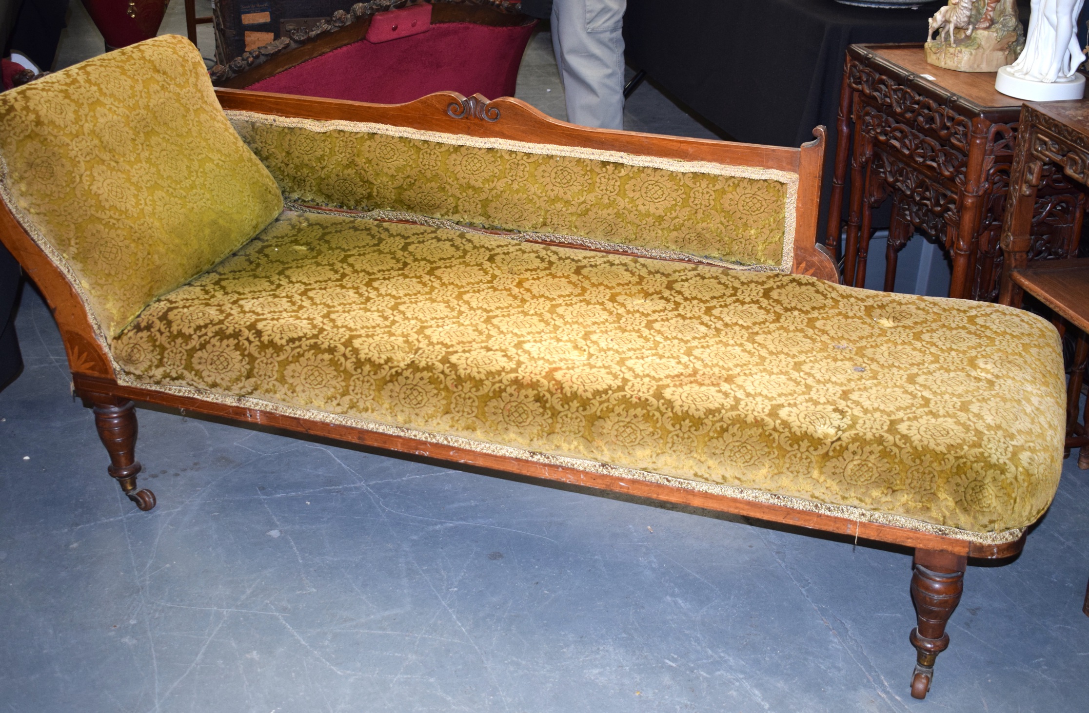 A LATE 19TH CENTURY CONTINENTAL CHAISE LONGE, upholstery with flowers. 170 cm x 60 cm.