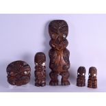 A COLLECTION OF FIVE MAORI TRIBAL CARVINGS in various forms and sizes. Largest 32 cm long. (5)