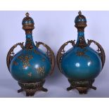 A PAIR OF EARLY 20TH CENTURY AUSTRIAN PORCELAIN TWIN HANDLED VASES, blue ground and overlaid with