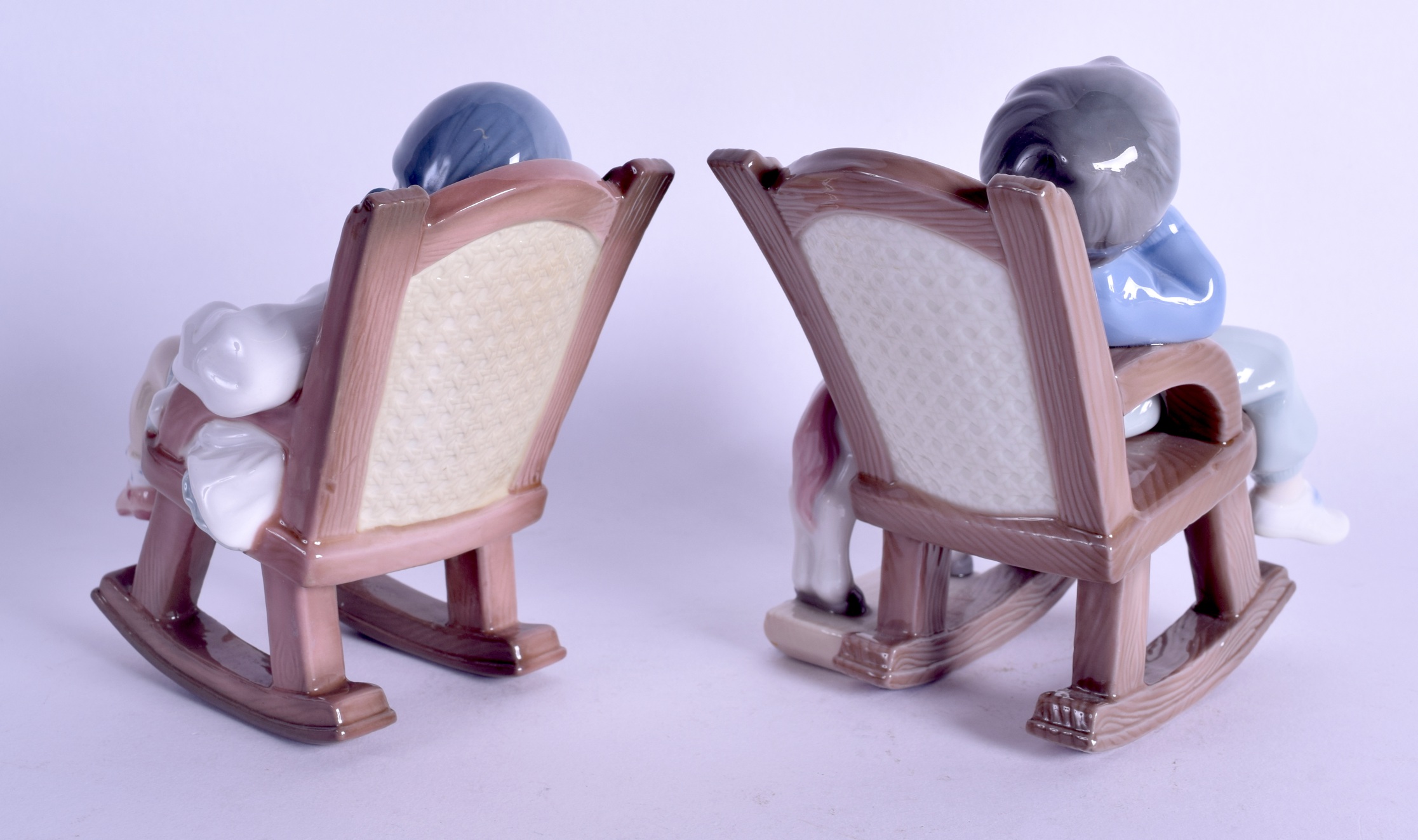 A PAIR OF LLADRO PORCELAIN FIGURES OF SLEEPING CHILDREN modelled upon chairs. 14 cm high. - Image 2 of 3