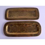 A PAIR OF 18TH/19TH CENTURY MIDDLE EASTERN BRASS DISHES of rectangular form, decorated with Kufic