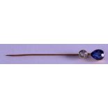 A VICTORIAN GOLD AND SAPPHIRE TIE PIN. 6.75 cm long.