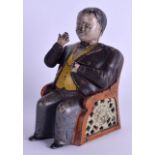 A RARE VICTORIAN TAMMANY CAST IRON MONEY BANK in the form of a seated banker. 15 cm x 10 cm.