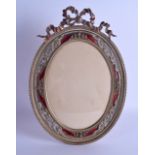 A LARGE EARLY 20TH CENTURY FRENCH COPPER BRASS AND ENAMEL PHOTOGRAPH FRAME decorated with foliage