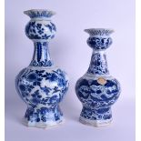 TWO LARGE 18TH CENTURY DELFT BLUE AND WHITE VASES painted with flowers. 31 cm & 27 cm high. (2)