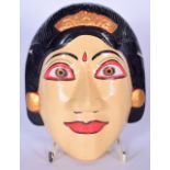A BALINESE CARVED WOODEN RAJA PUTRI DANCE MASK, forming the "perfect noblewoman". 18.5 cm x 15.5