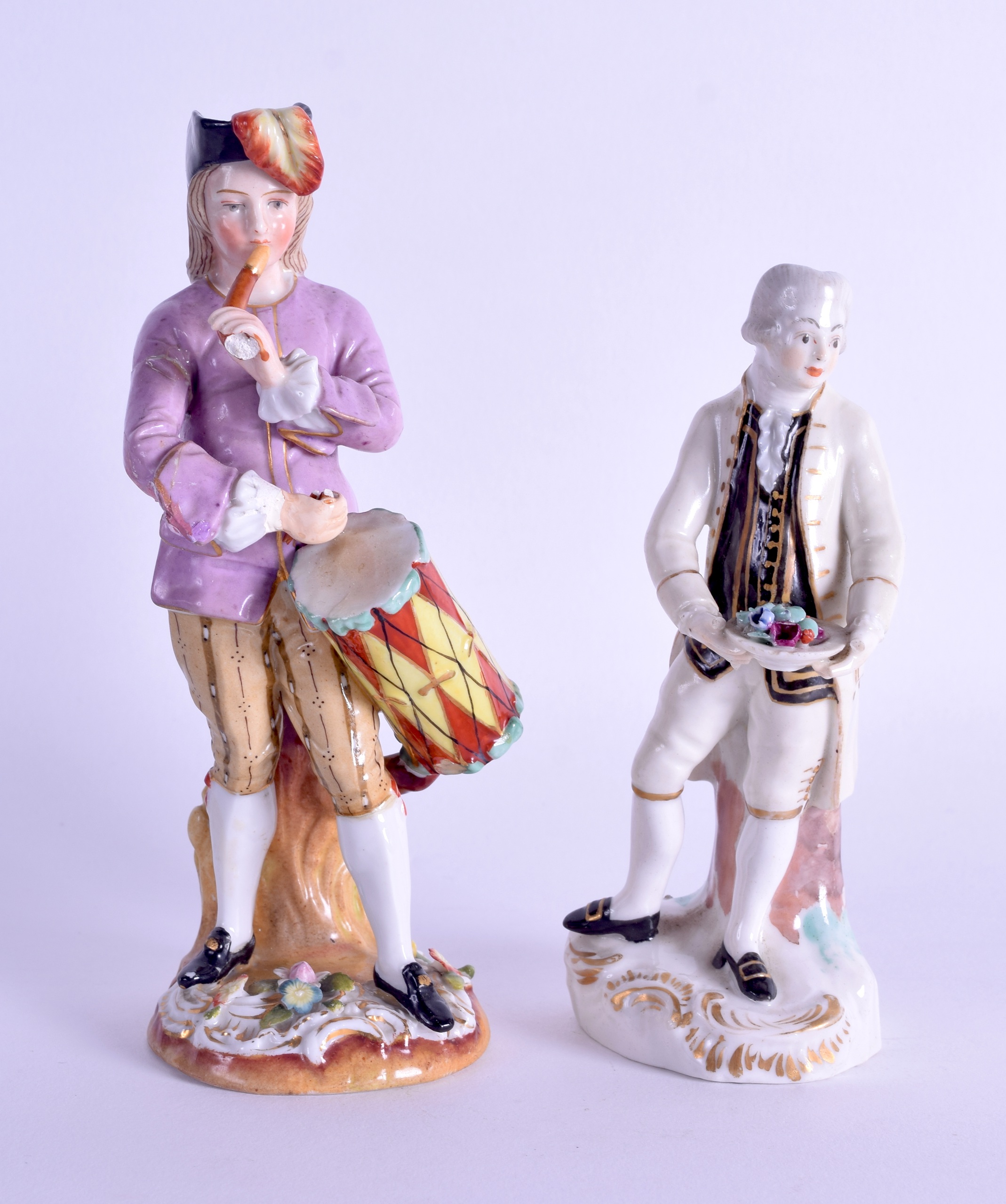 A 19TH CENTURY GERMAN PORCELAIN FIGURE OF A DRUMMER together with a smaller early 19th century