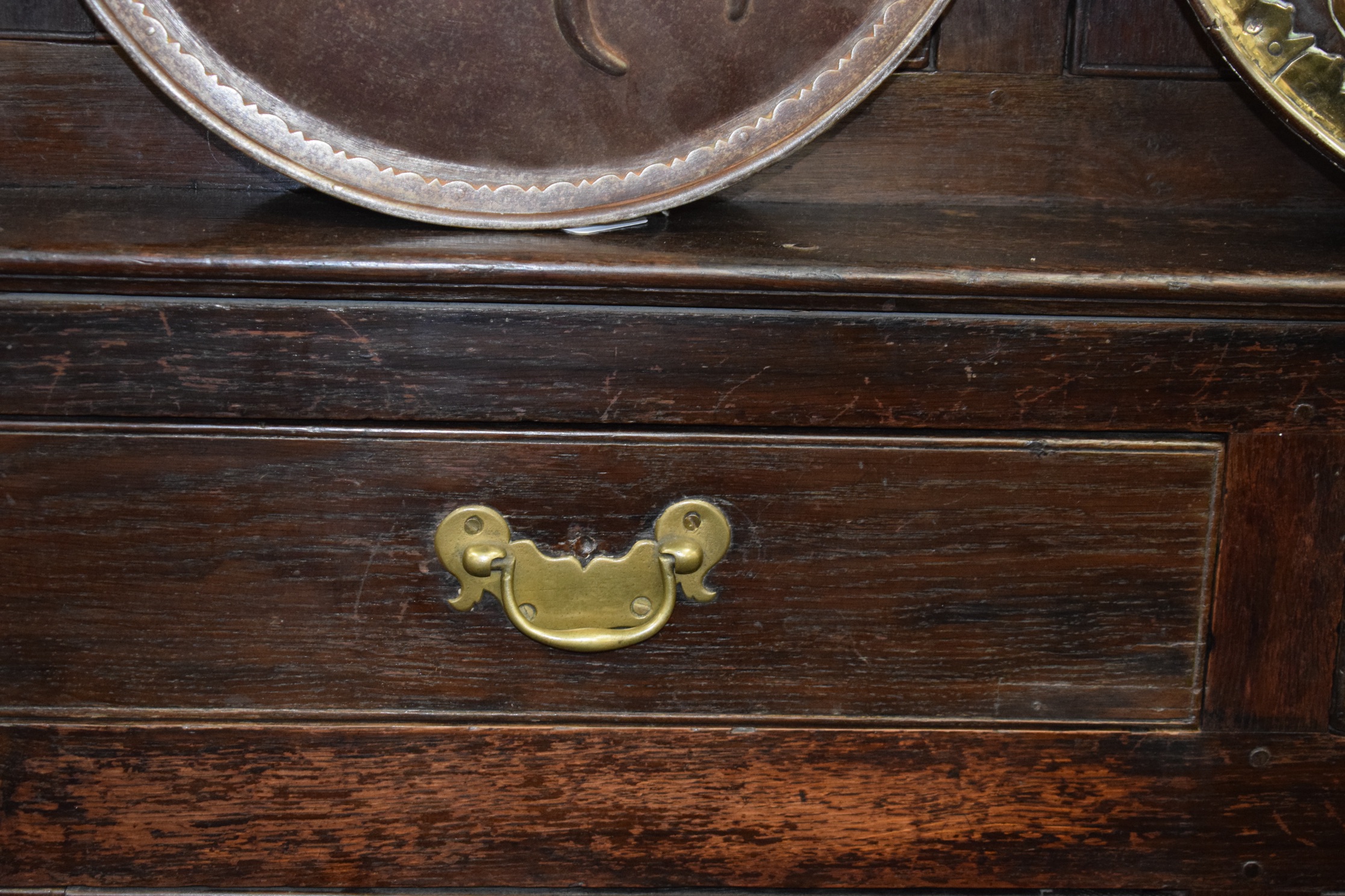 AN 18TH CENTURY OAK COURT CUPBOARD, with fitted drawers, panelled doors and swan neck brass handles. - Image 3 of 4