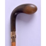 A VICTORIAN/EDWARDIAN RHINOCEROS HORN HANDLED WALKING CANE. 72 cm long.