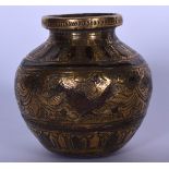 AN EARLY 20TH CENTURY COPPER INLAY ISLAMIC VESSEL, decorated with birds and foliage. 8 cm high.