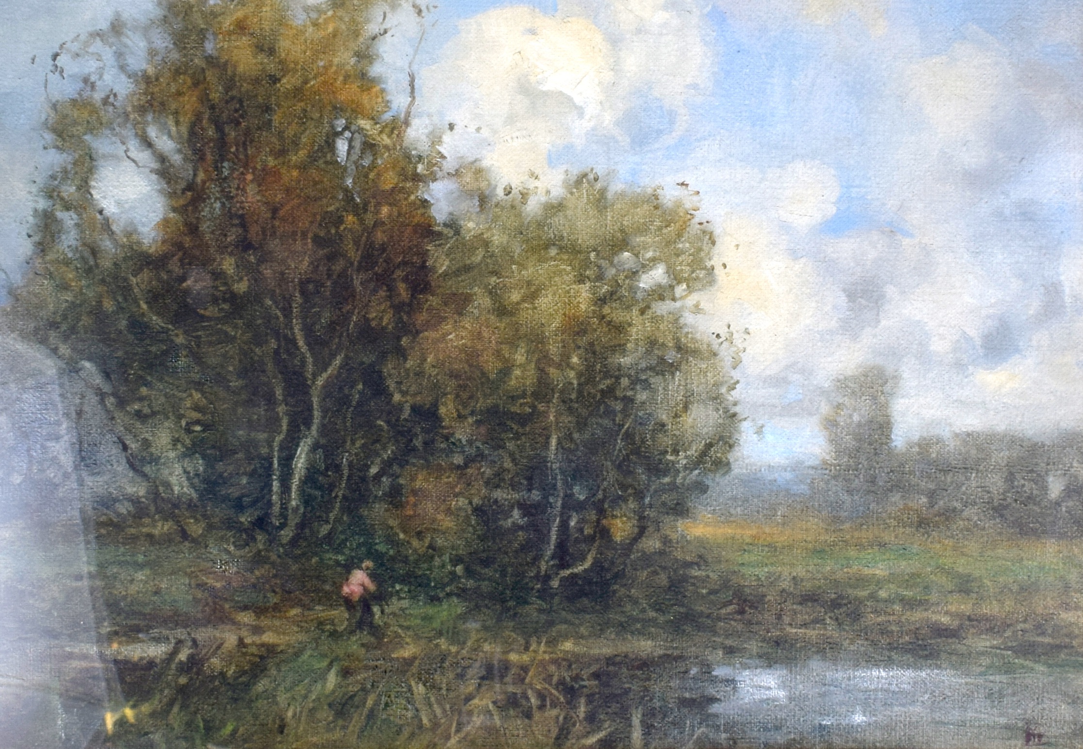 ENGLISH SCHOOL (19th/20th century), framed oil on board, a figure beside a lake in a landscape. 23