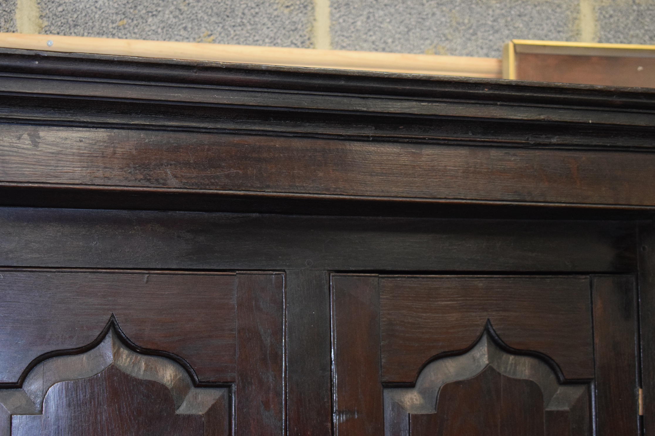 AN 18TH CENTURY OAK COURT CUPBOARD, with fitted drawers, panelled doors and swan neck brass handles. - Image 2 of 4