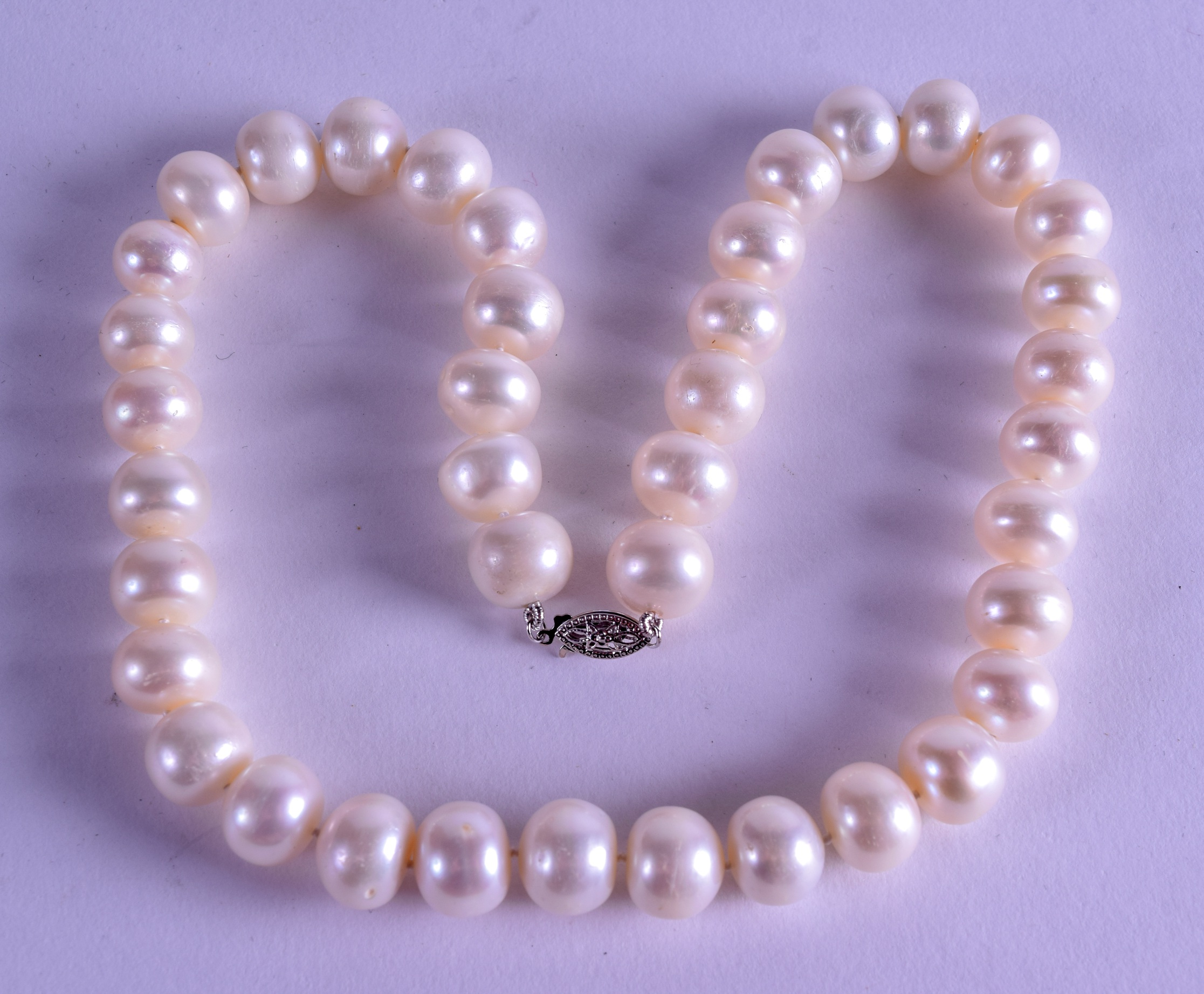 A WHITE GOLD AND PEARL NECKLACE. 40 cm long.