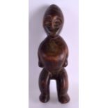AN EARLY 20TH CENTURY AFRICAN TRIBAL CARVED WOOD FIGURE modelled standing with mouth open. 37 cm