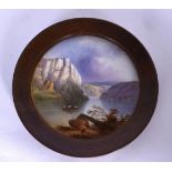 A EUROPEAN PORCELAIN PLAQUE, painted with figures in a boat in a mountainous landscape. 17 cm wide.