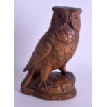 A 19TH CENTURY BAVARIAN BLACK FOREST TOBACCO JAR in the form of an owl upon a naturalistic stump. 24