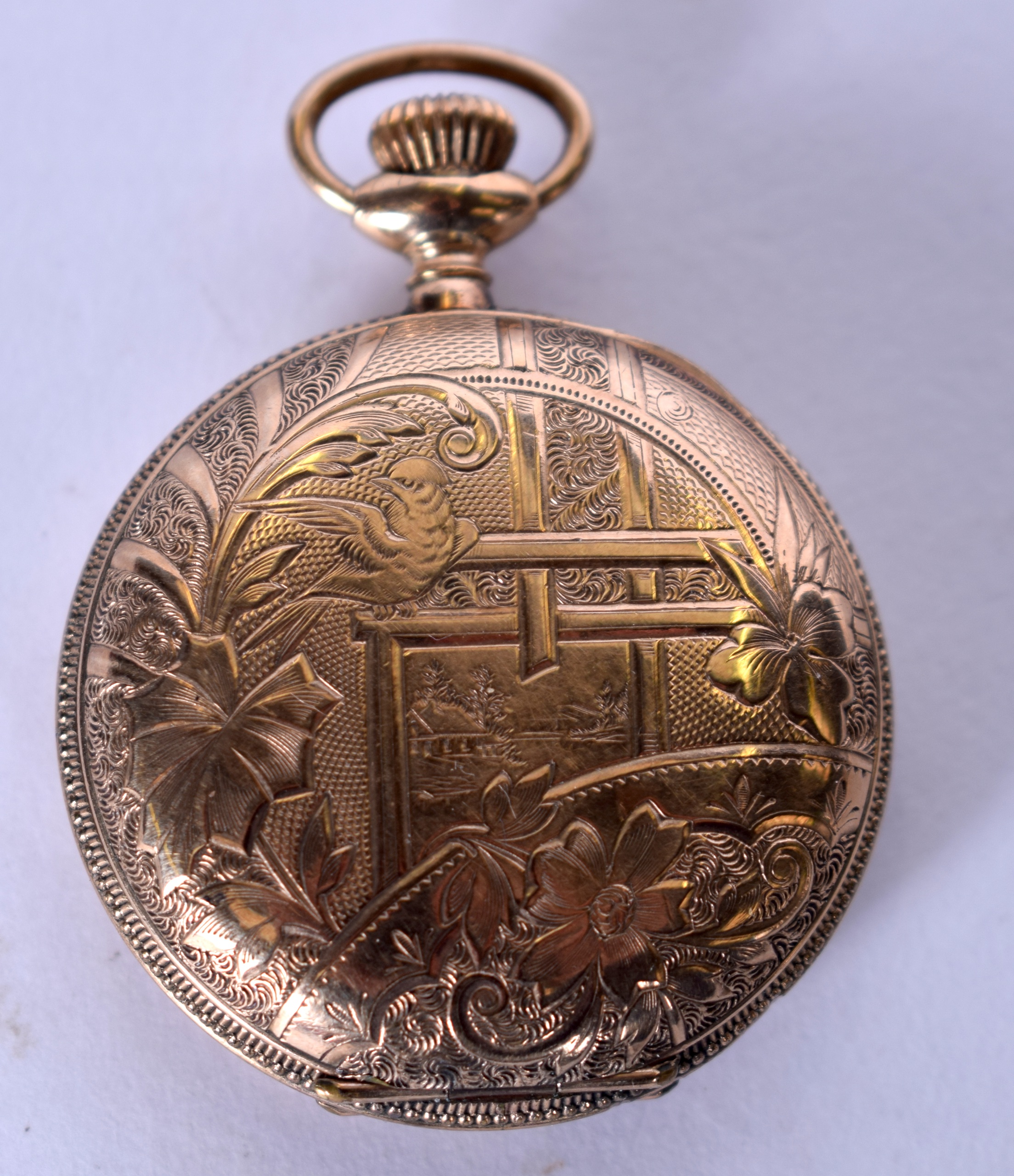 A NEW YORK STANDARD WATCH CO. YELLOW METAL POCKET WATCH, the case engraved with birds amongst - Image 3 of 4