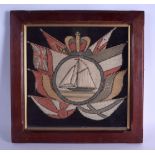 AN EARLY VICTORIAN FRAMED SAILORS MARITIME WOOLWORK depicting a boat encased within flags. Image