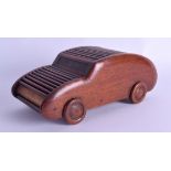 A RARE 1940 NOVELTY CARVED WOOD AUTOMOTIVE CIGARETTE DISPENSER in the form of a car. 21 cm x 10 cm.