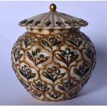 AN EARLY 20TH CENTURY PERSIAN IVORY BOX AND COVER, decorated with panels of foliage. 7.5 cm wide.