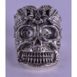 A SILVER SKULL RING. Size Q.