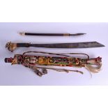 AN UNUSUAL TRIBAL ANTLER HORN HANDLED SWORD possibly a head hunter, with attached carved and painted